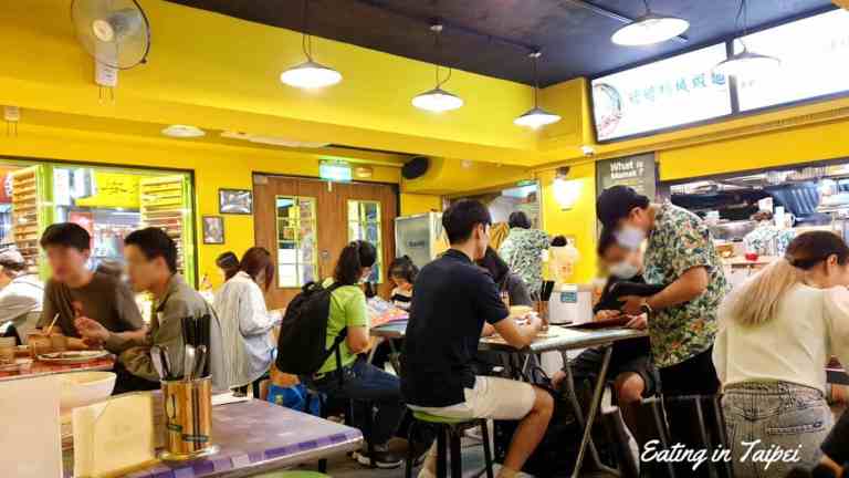 The yellow walls of outside also come inside. And the food stall-like tables with the stall-like chairs compliment the laid-back approach that Mamak is clearly going for. Note that all of the servers wear tropical looking shirts, too.